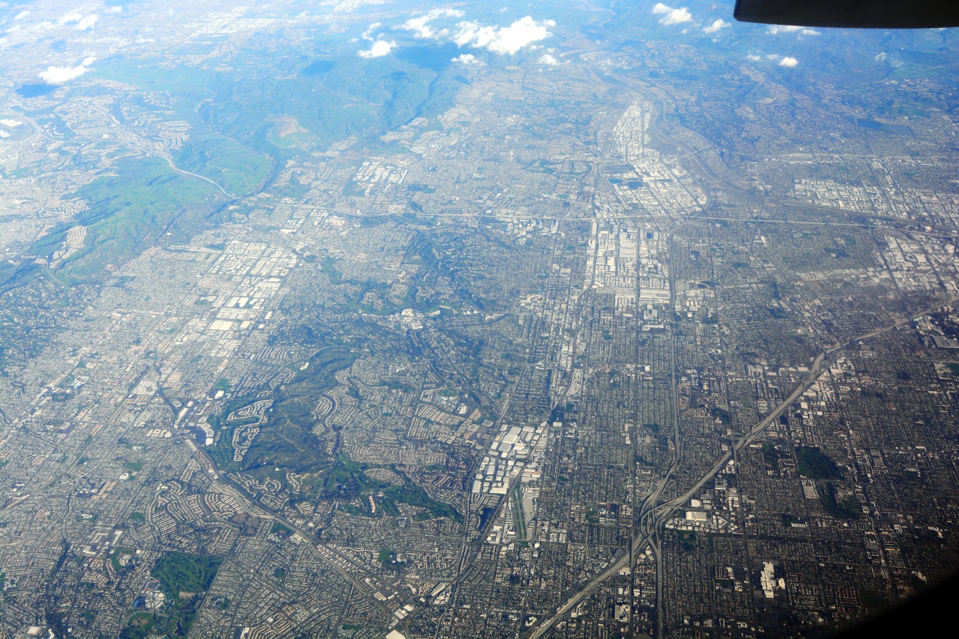 Aerial view looking just north of east toward La Habra, Fullerton, Yorba Linda, and Anaheim, CA